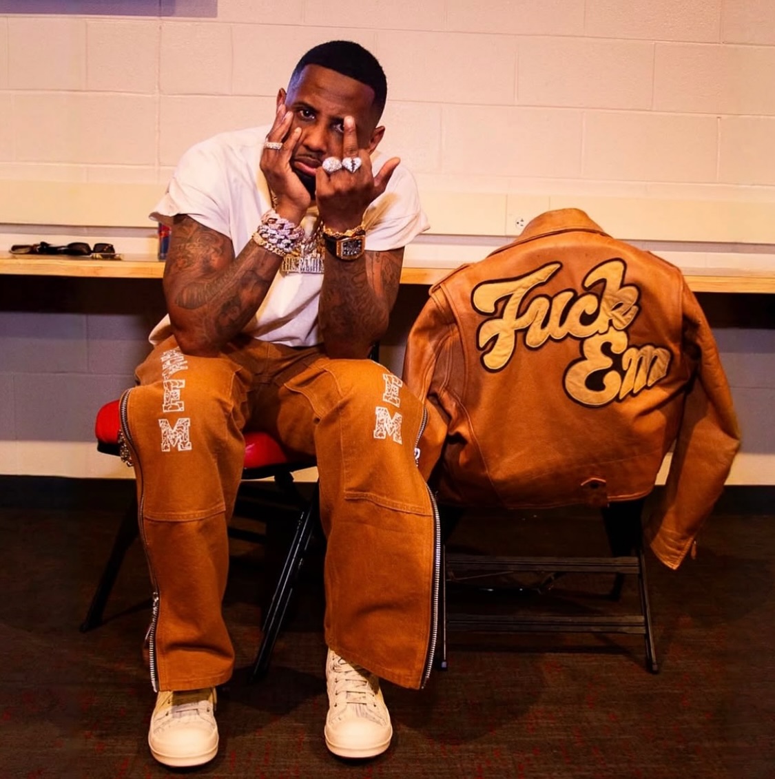 Fabolous backstage with the Fuck Em leather jacket