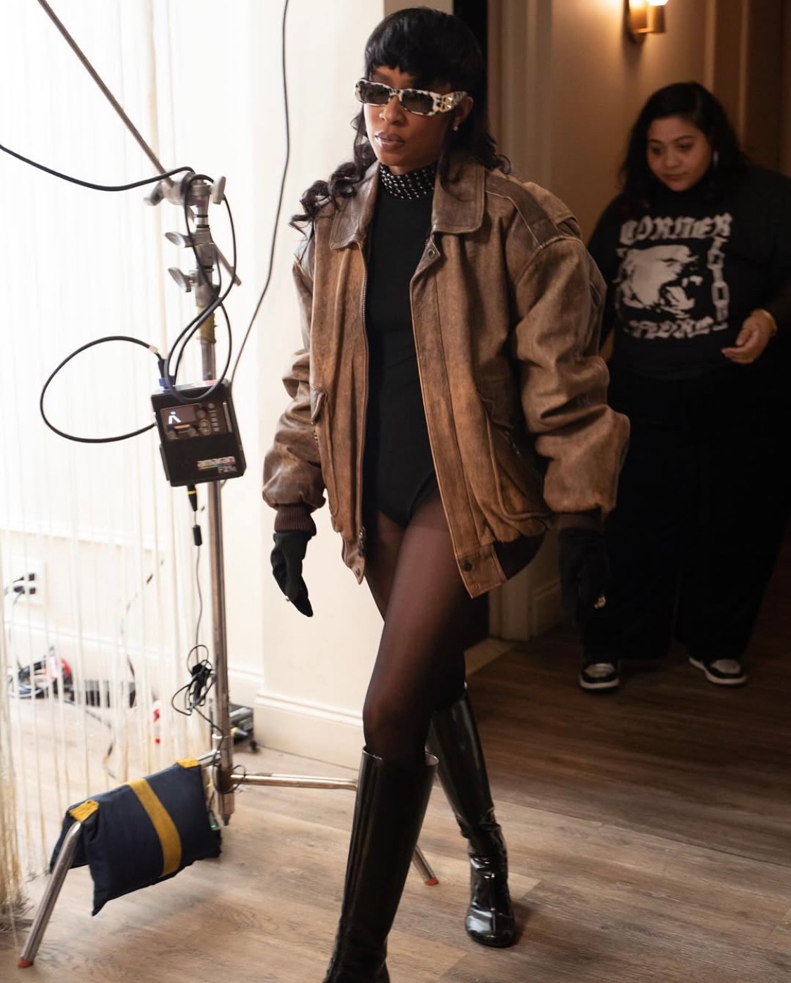 DeJ Loaf in a Fuck Em leather bomber